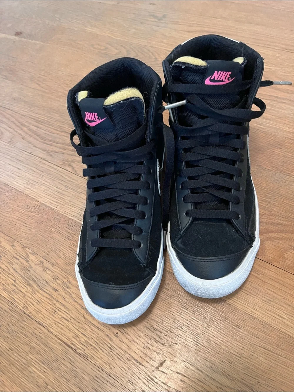 Nike Black High-Top Sneakers with White Sole and Pink Logo